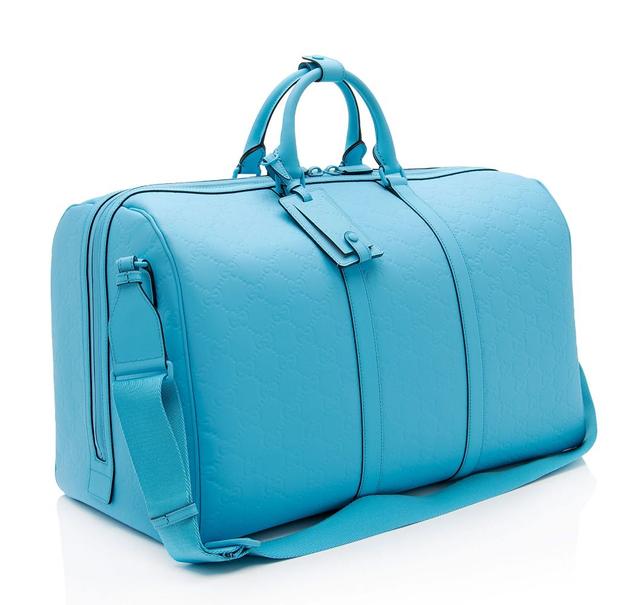 https://cdn.reebelo.com/pim/products/P-GUCCIGGRUBBEREFFECTLARGEDUFFLE/BLU-image-1.jpg